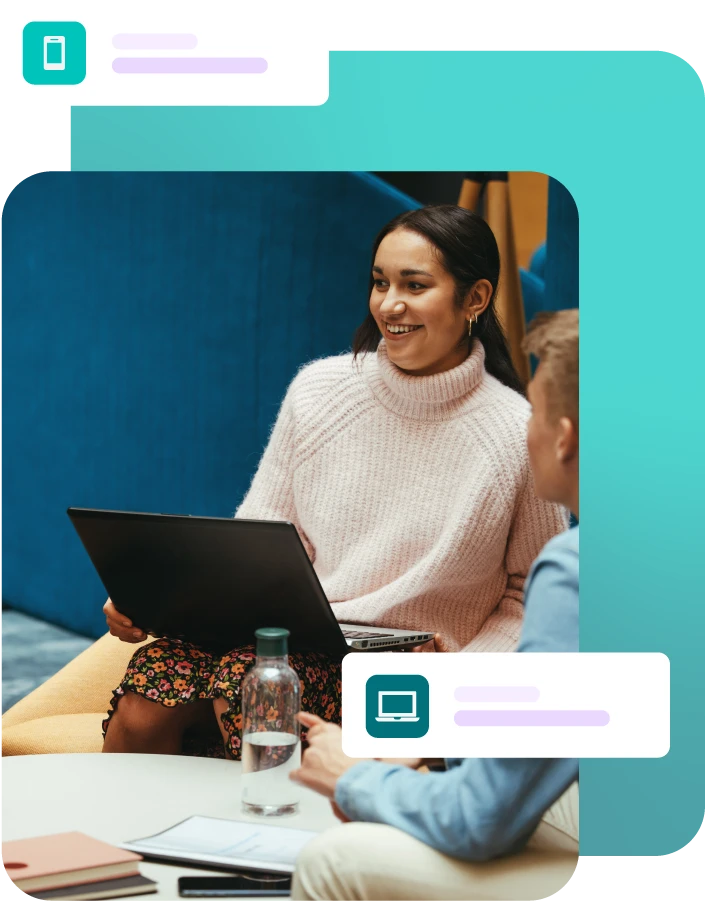 Lady sat with laptop during a group meeting